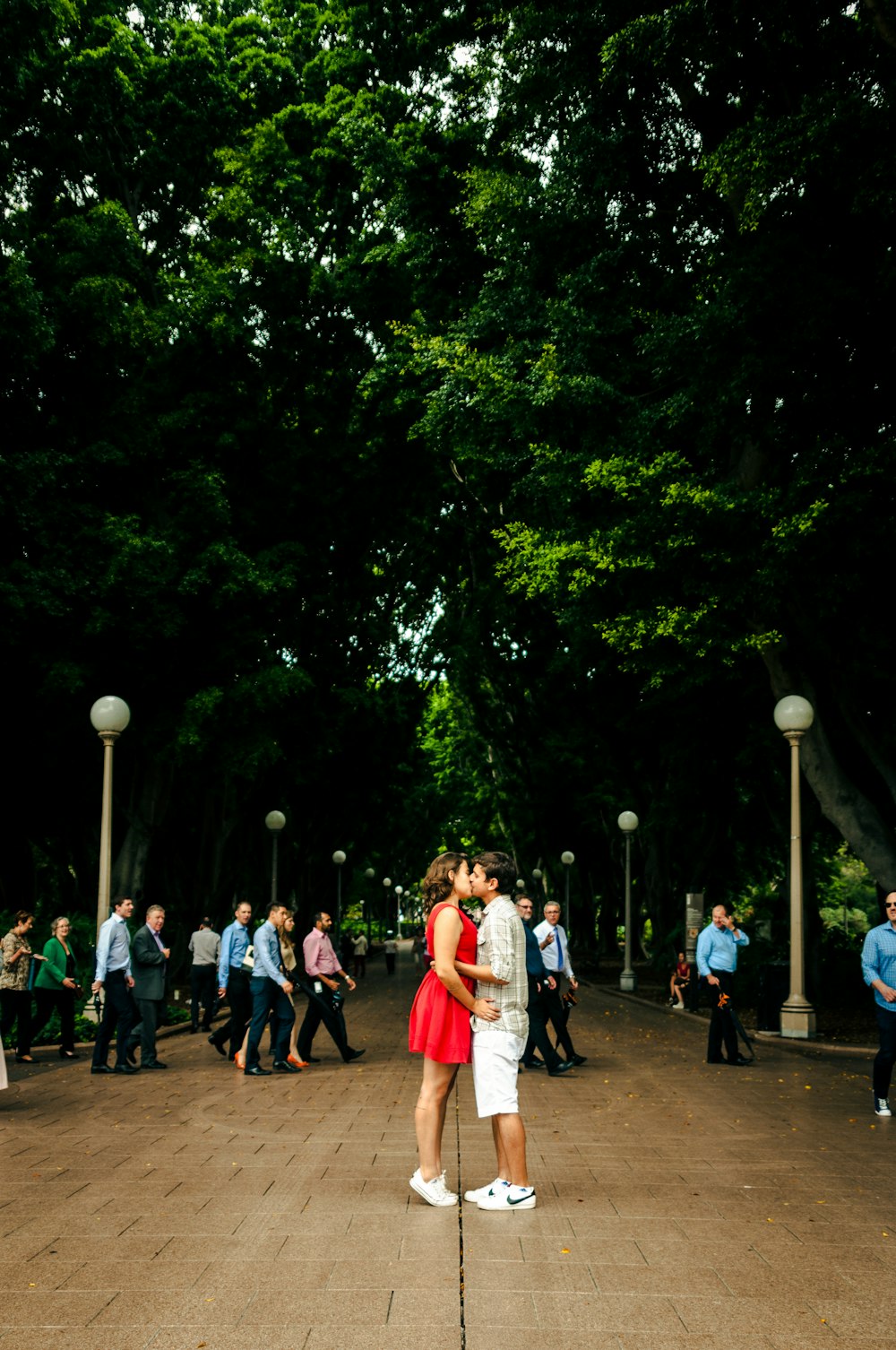 man and woman kissing each other