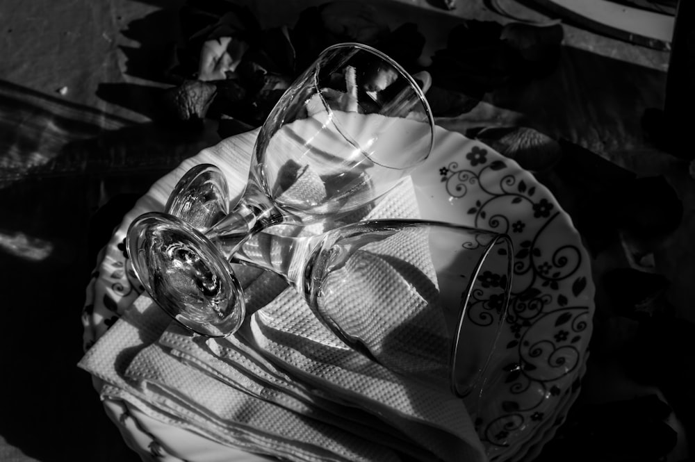 grayscale photography of clear wine glasses