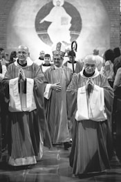 grayscale photo of priests