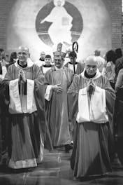 grayscale photo of priests