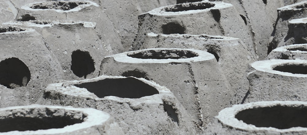 a close up of a group of cement pots