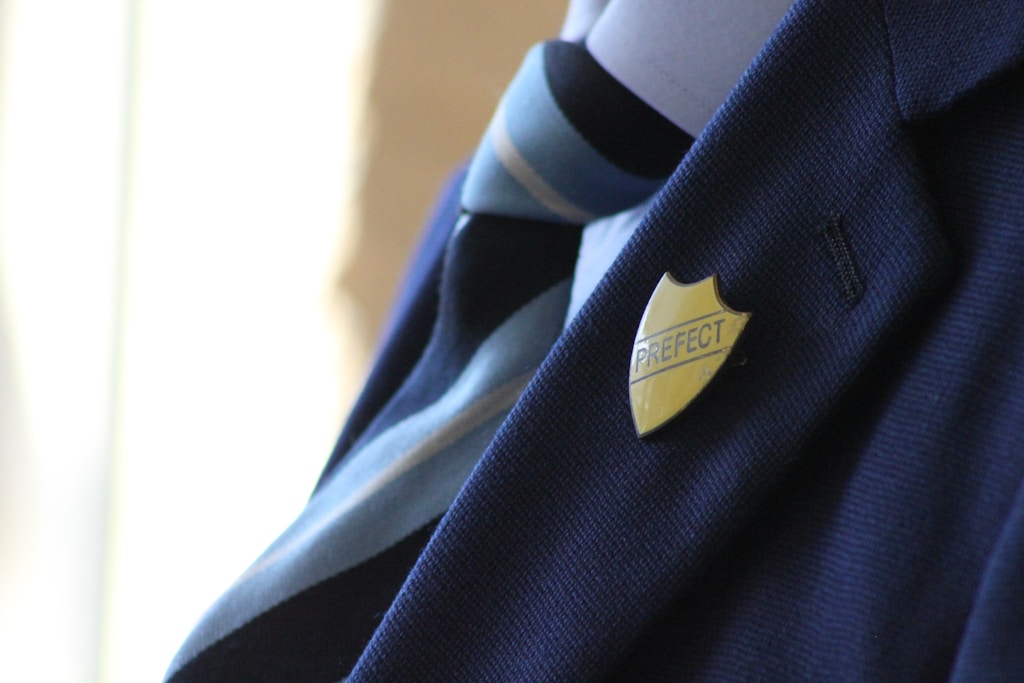 school pupil yellow Prefect pin