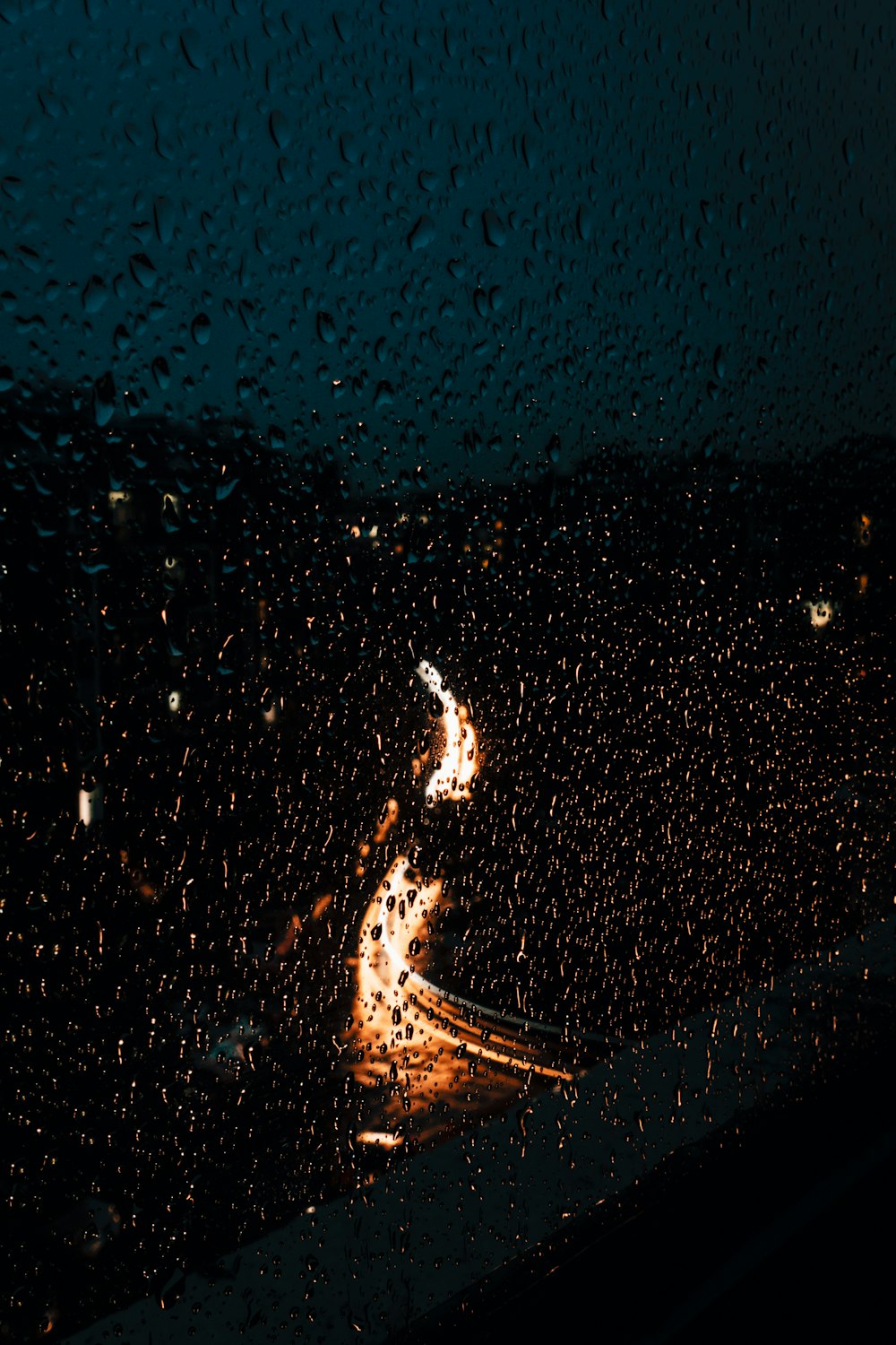 a picture taken through a rain covered window