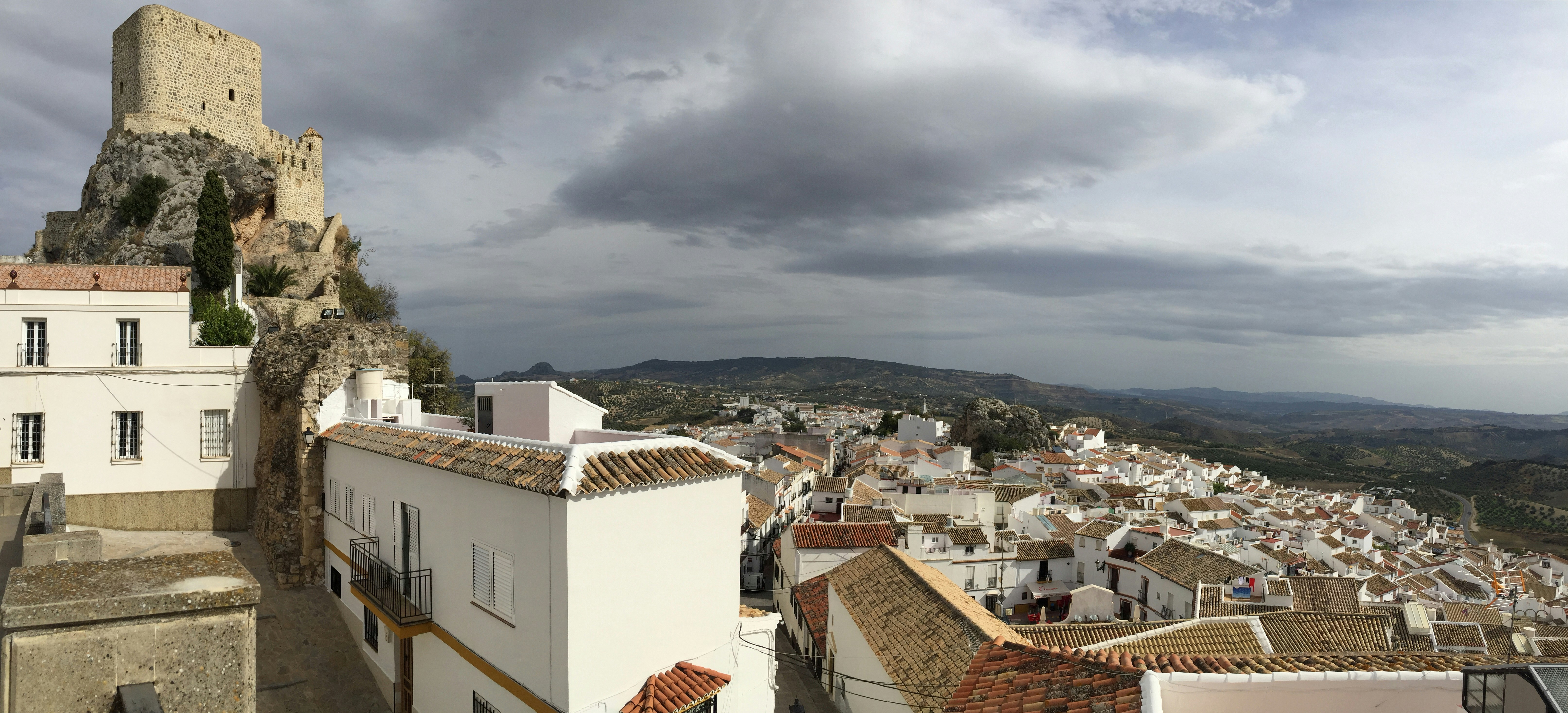 Mountain village, white houses and castle with Arab origin in the Cádiz province (Spain)