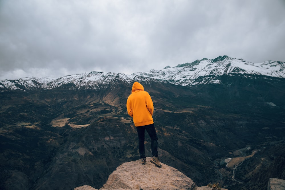 person standing on rock