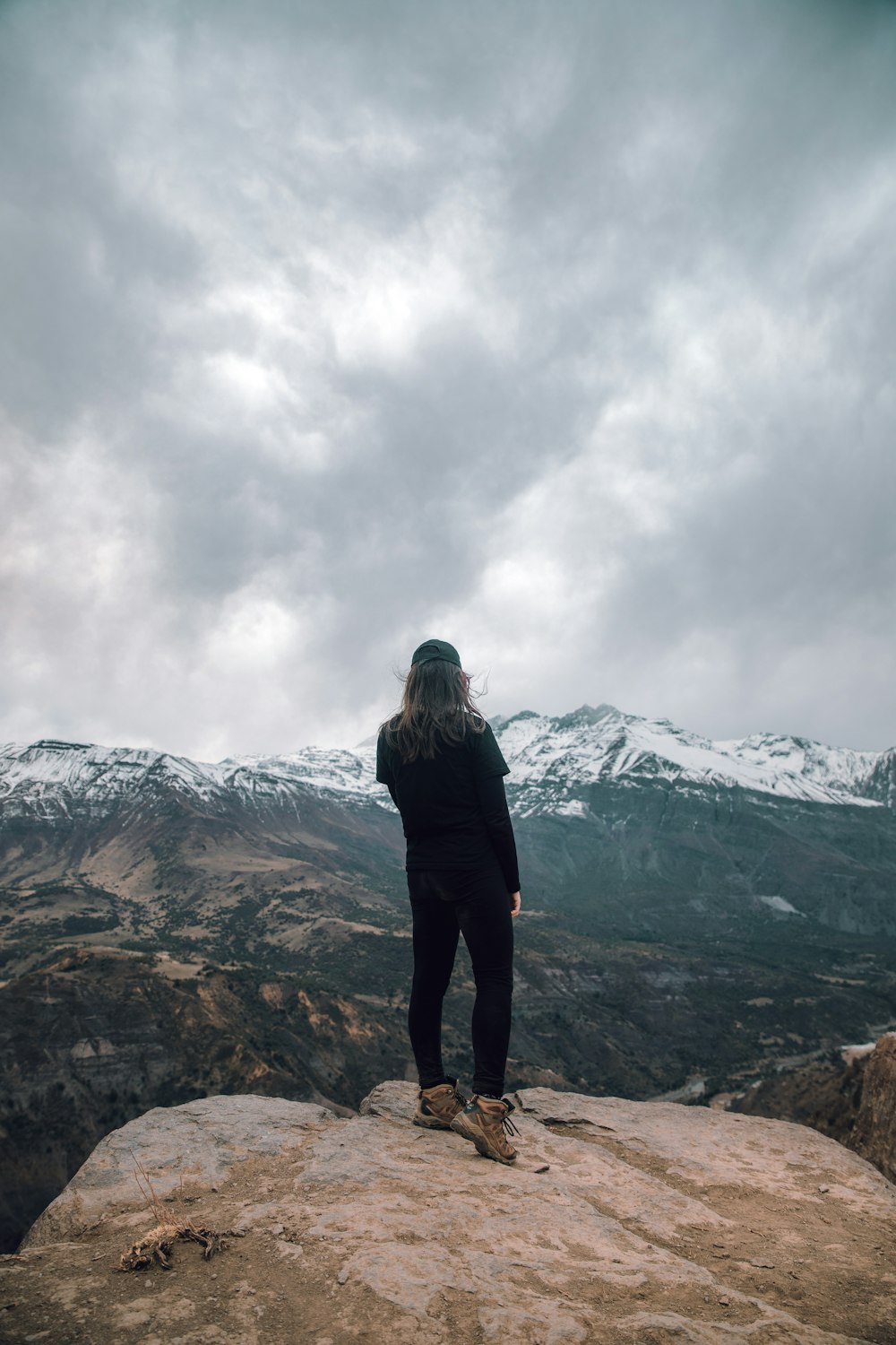 woman in a black shirt at a cliff