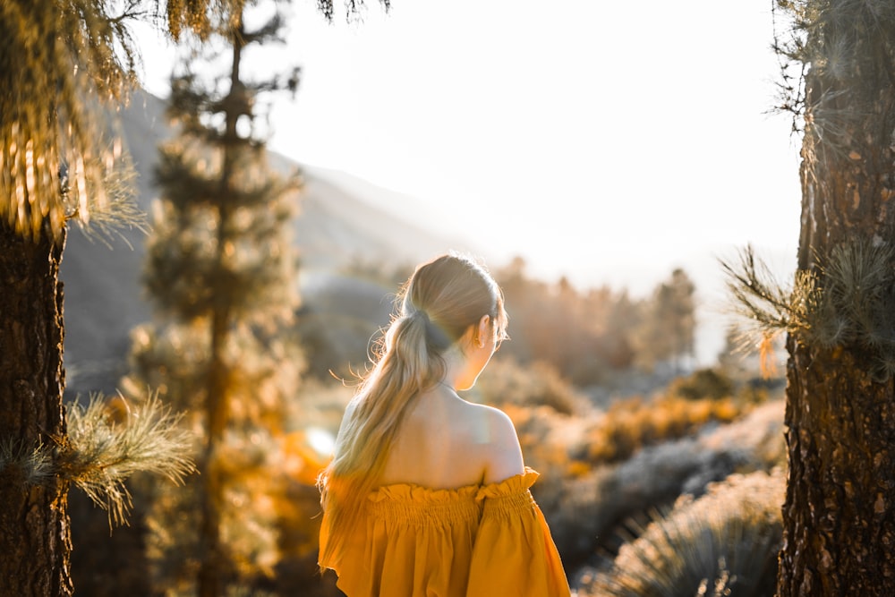 woman wearing yellow off-shoulder top