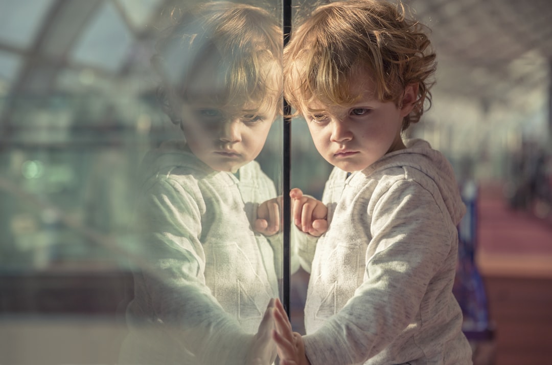 boy in gray hoodie, REFLECTING