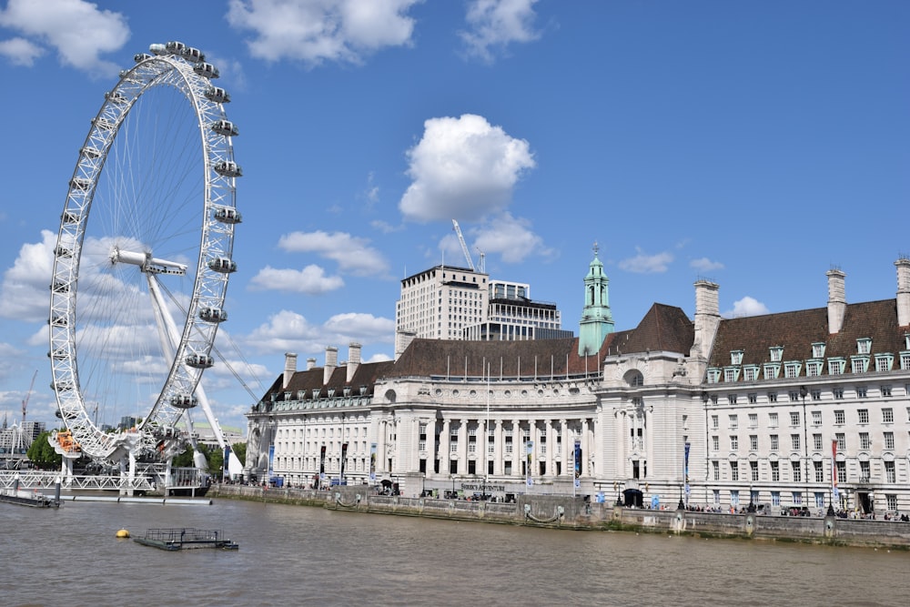 ferris wheel beside buildings