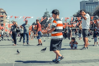 A friendly community gathering in Peterborough’s historic city center, with people chatting and sharing ideas.
