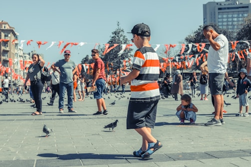 A friendly community gathering in Peterborough’s historic city center, with people chatting and sharing ideas.