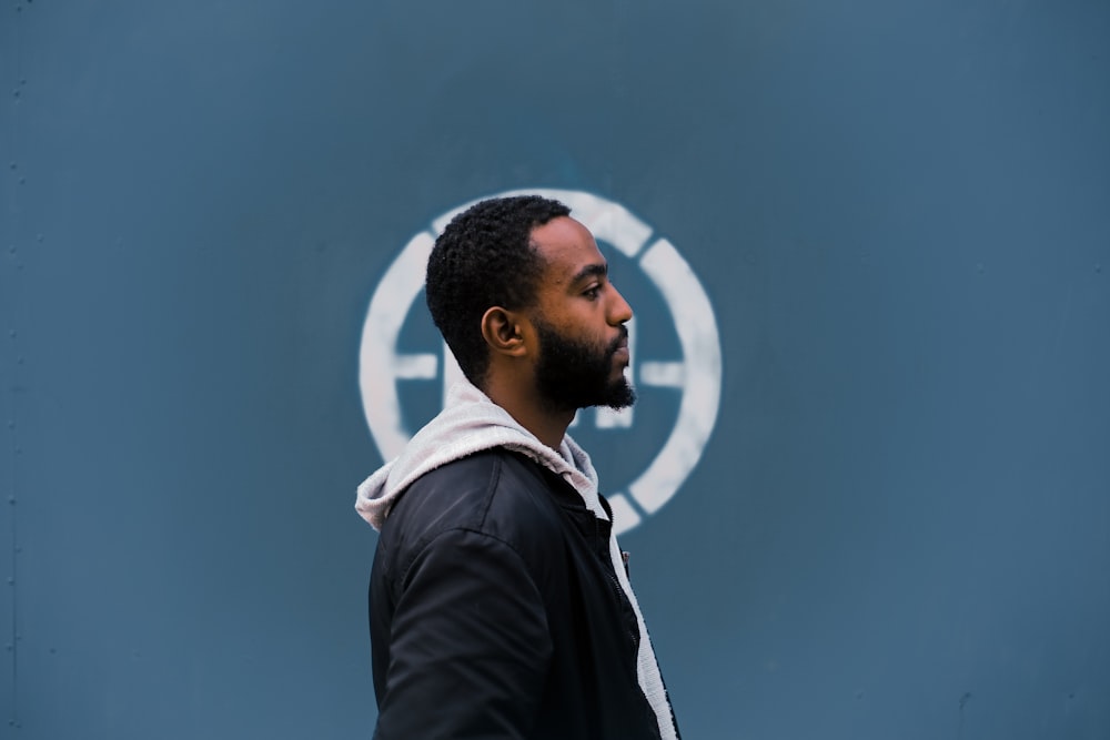 man in a black and white hoodie jacket