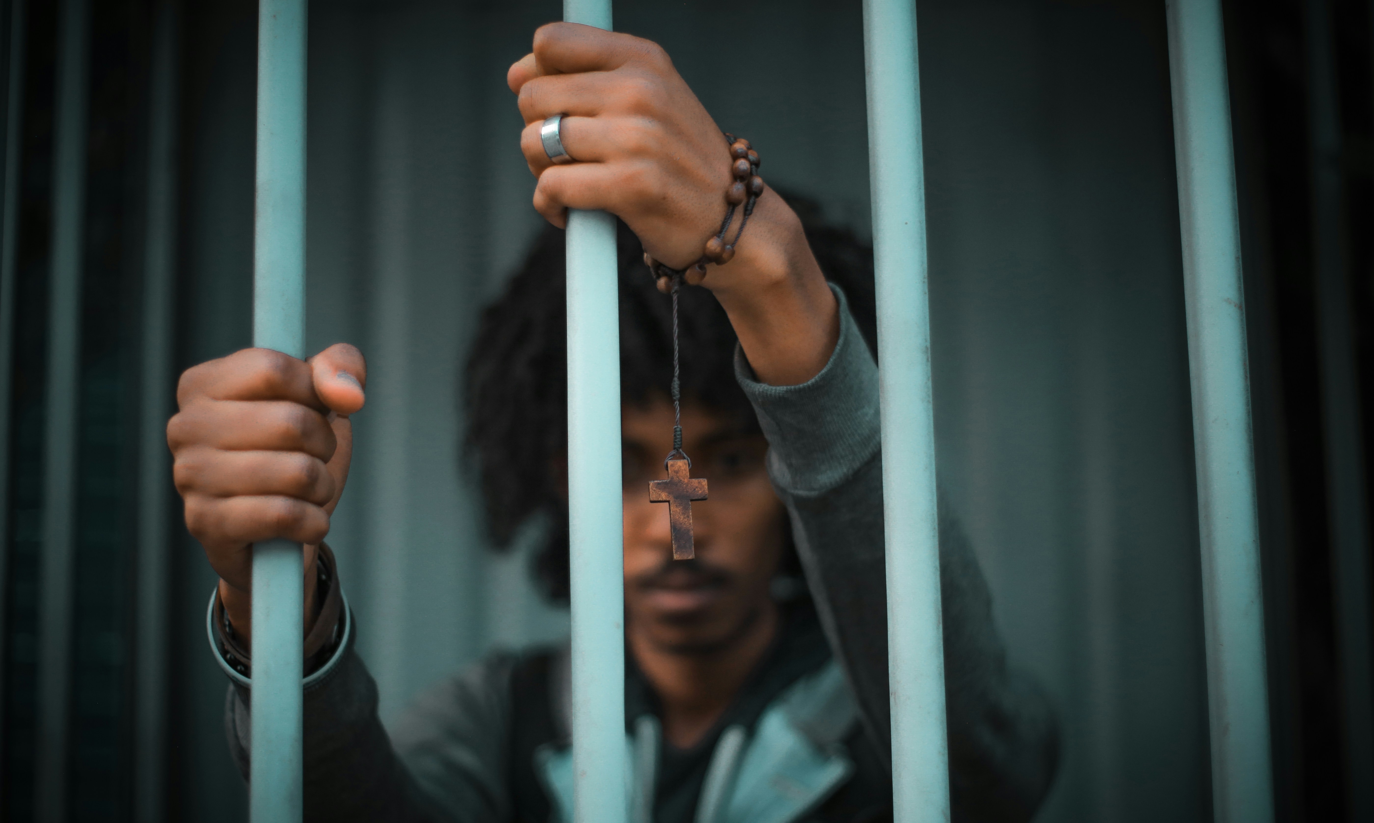 man holding grill fence