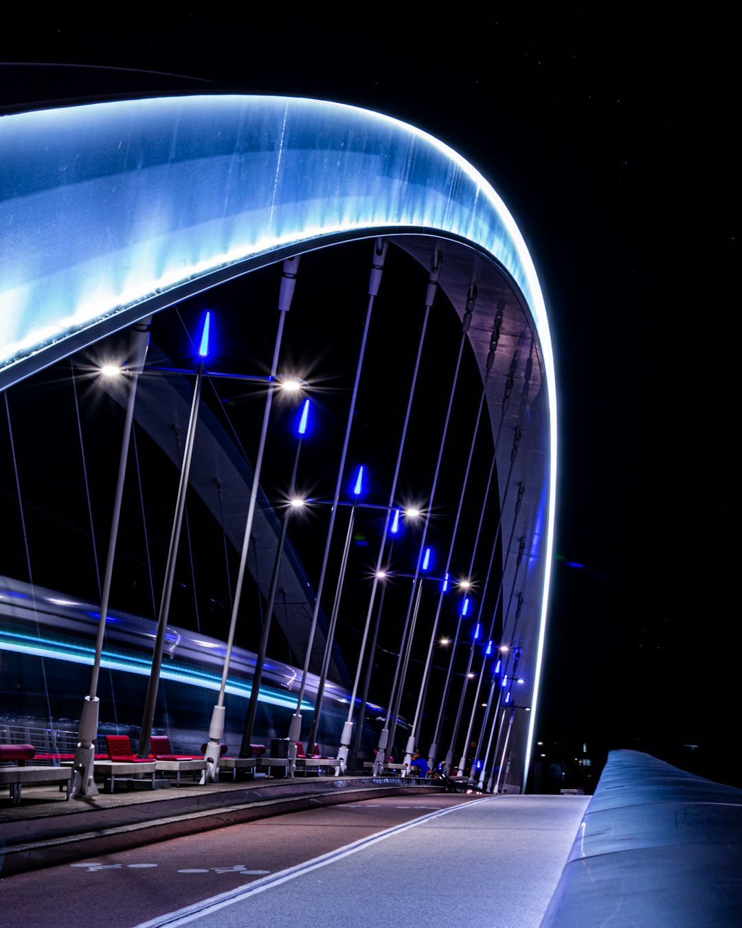 building with lounge chairs during night