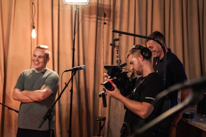 Ed Gordon filming a YouTube video in a cozy, well-lit home studio.