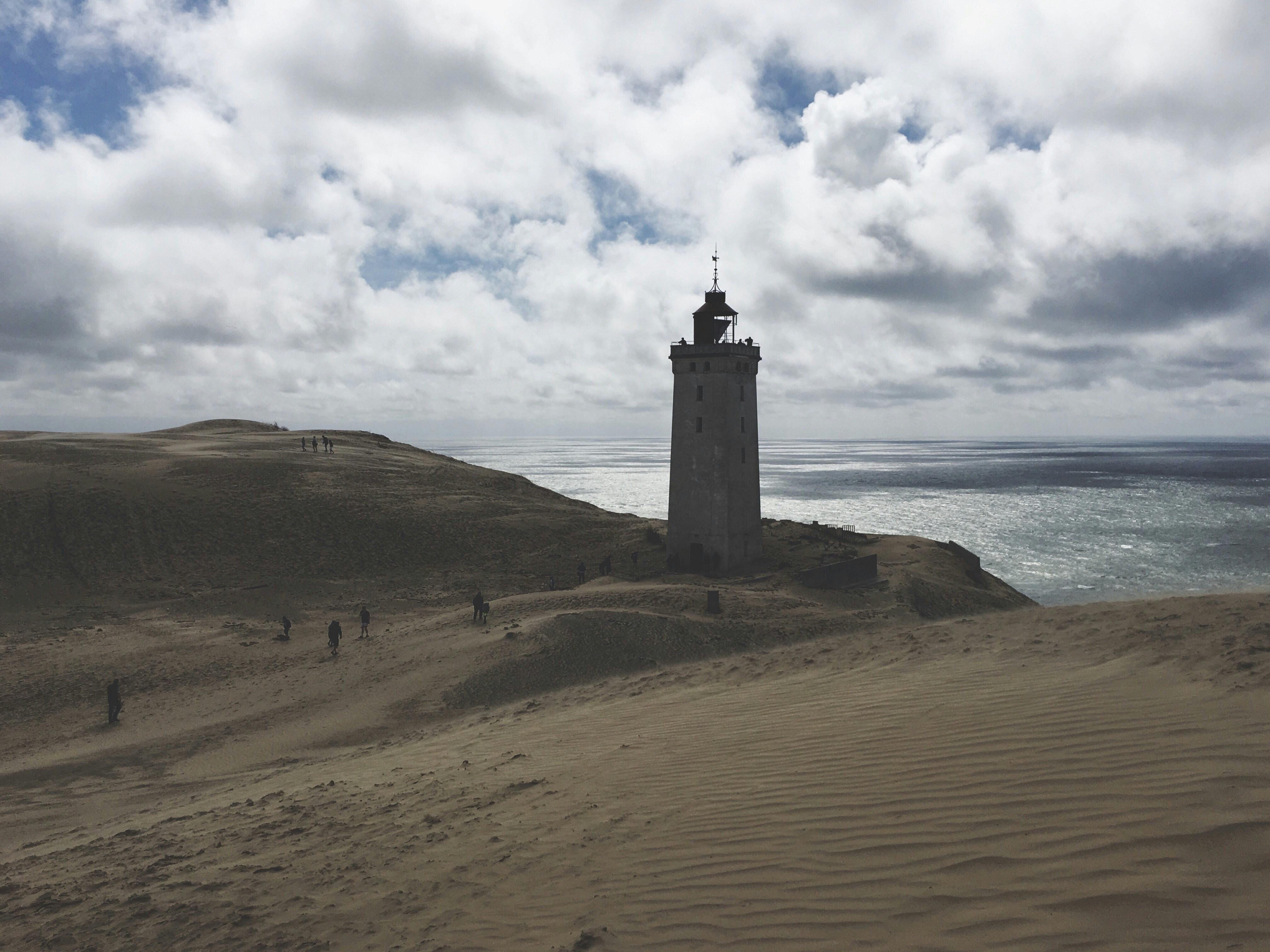 brown watchtower across body ofwater