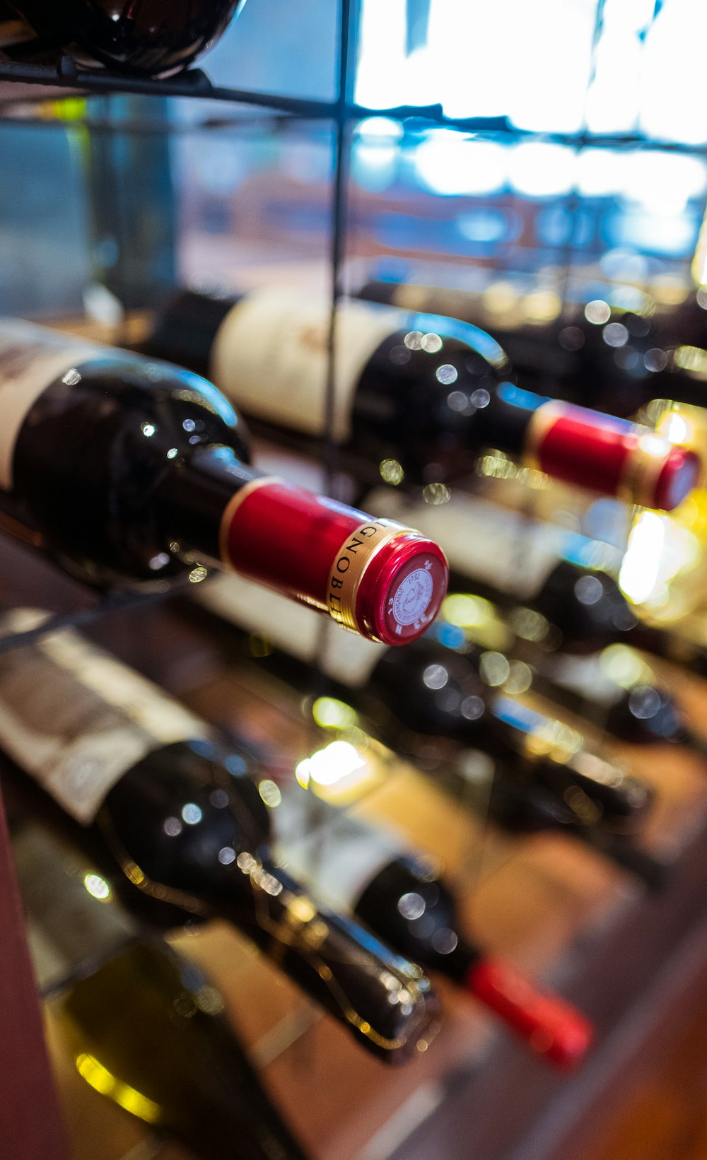 wine bottles on glass wine rack