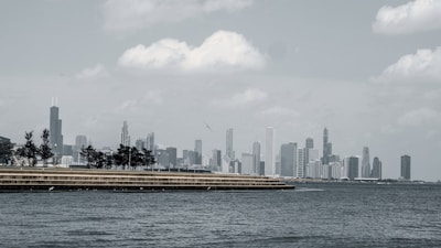 Executives reviewing investment portfolios with city skyline in the background.