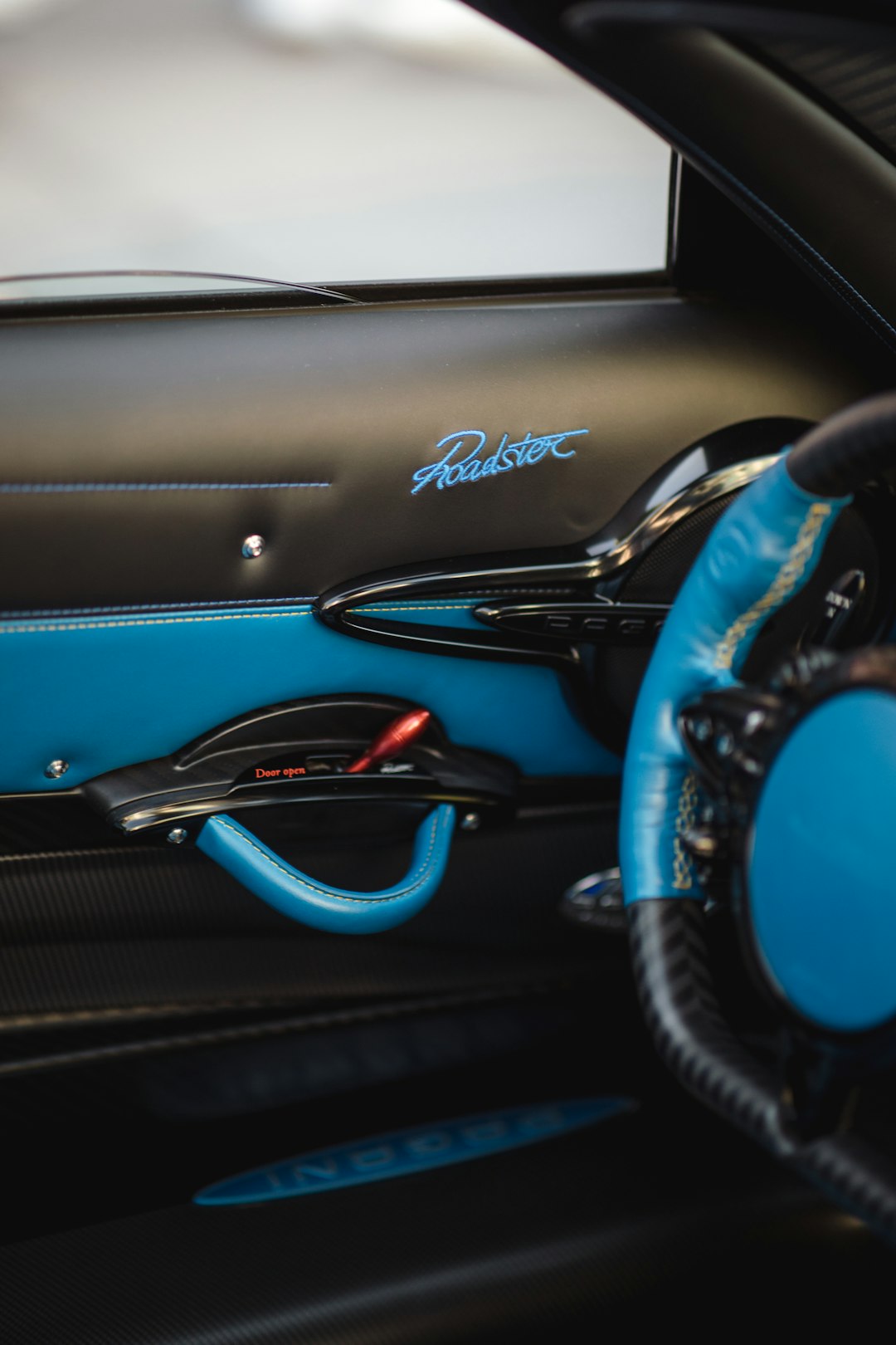 blue and black car steering wheel