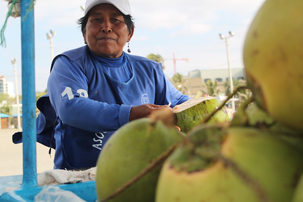 woman near coconut fruits