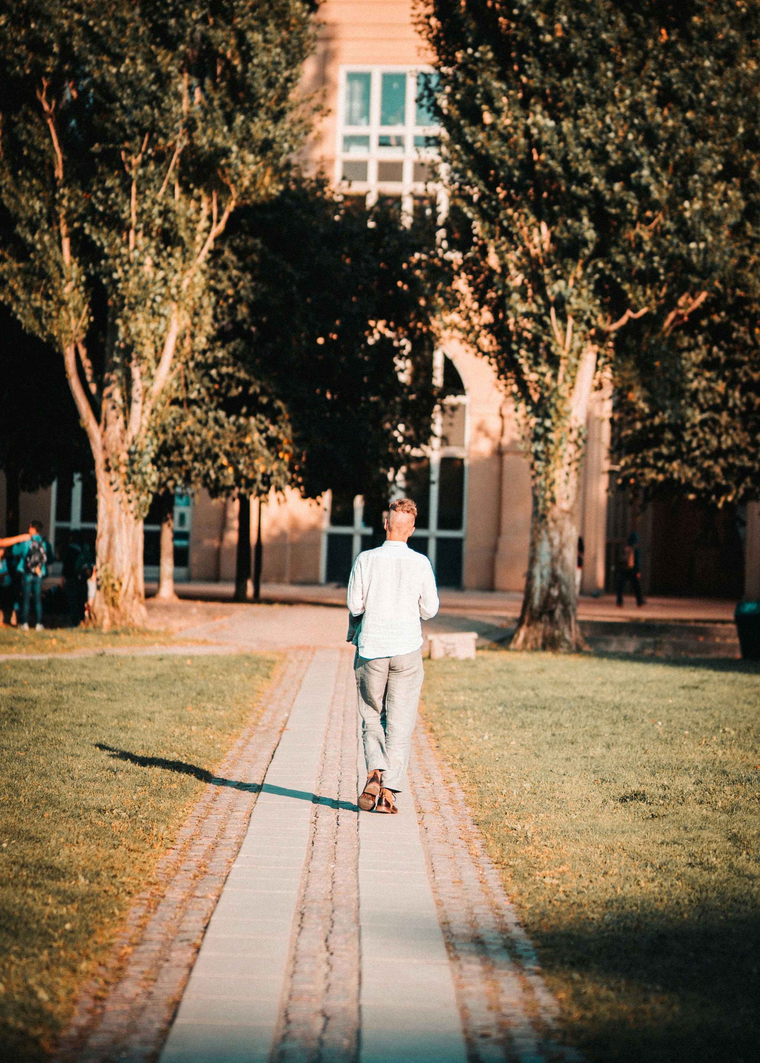 Man walking on pathway photo – Free Human Image on Unsplash