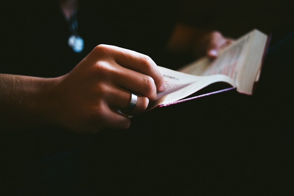 person holding book