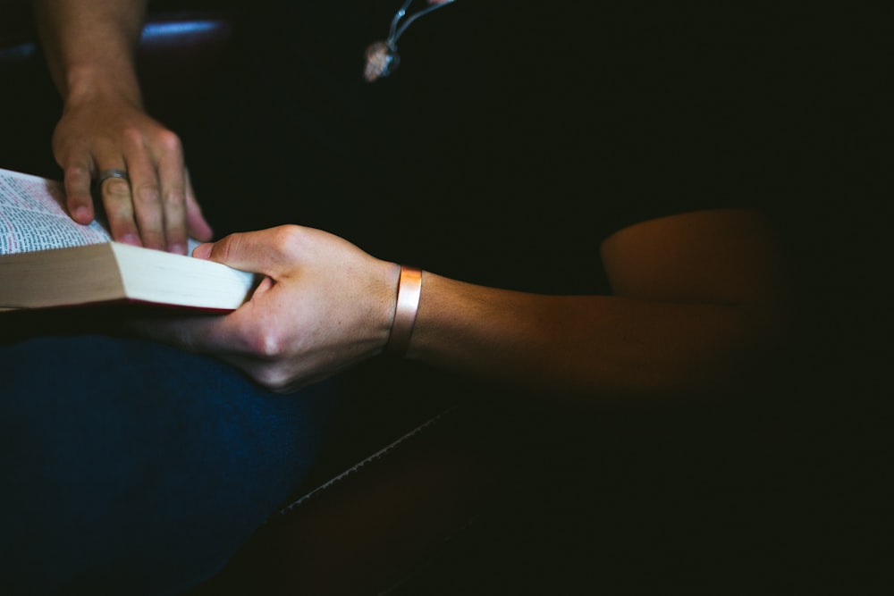 person holding book