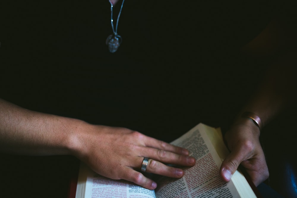 person holding open book