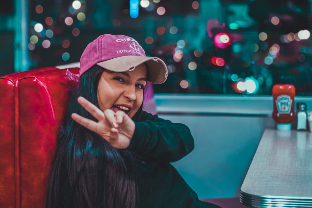 woman wears pink cap