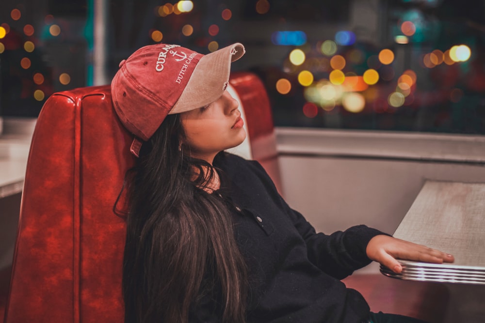 woman wears red cap