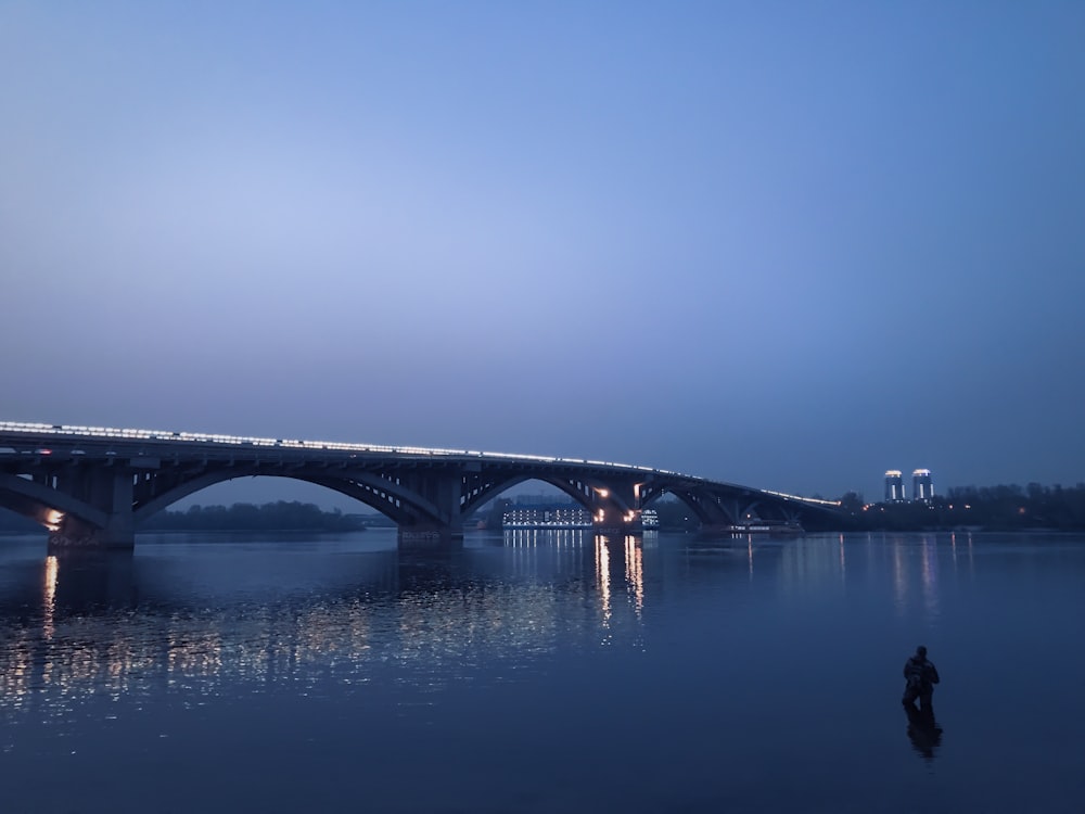 calm body of water near bridge