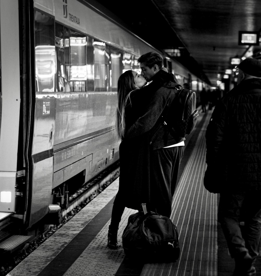 grayscale photo of man and woman