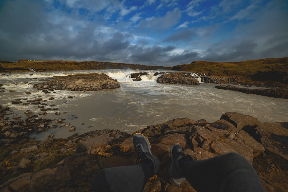 body of water and stones