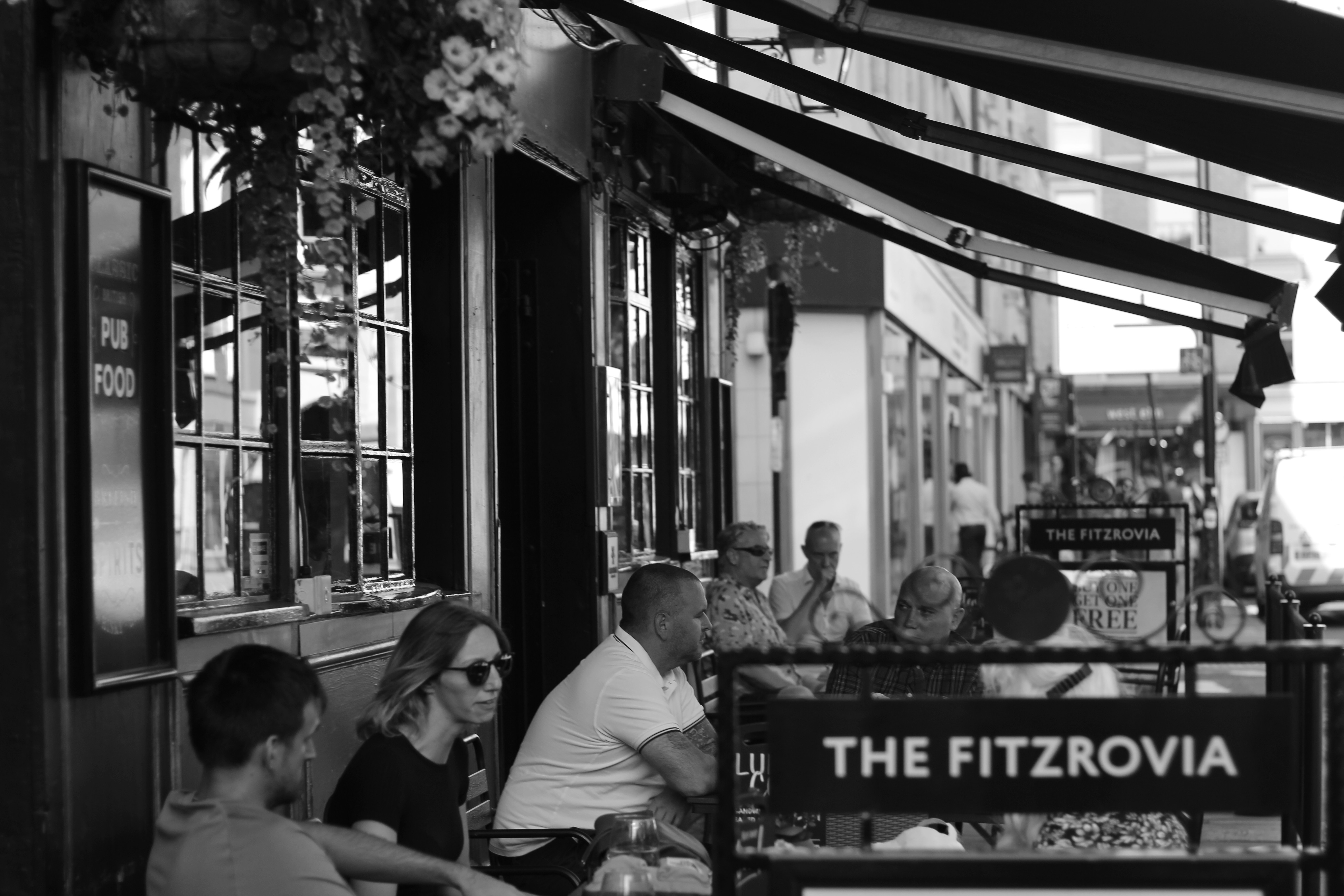 A Fitzrovia street scene near cafés and gardens