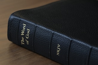 Close-up of a beautifully bound King James Version New Testament with gold-edged pages.