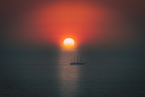 KM. Sultan Hasanuddin sailing at sunset, reflecting the company’s commitment to service and community