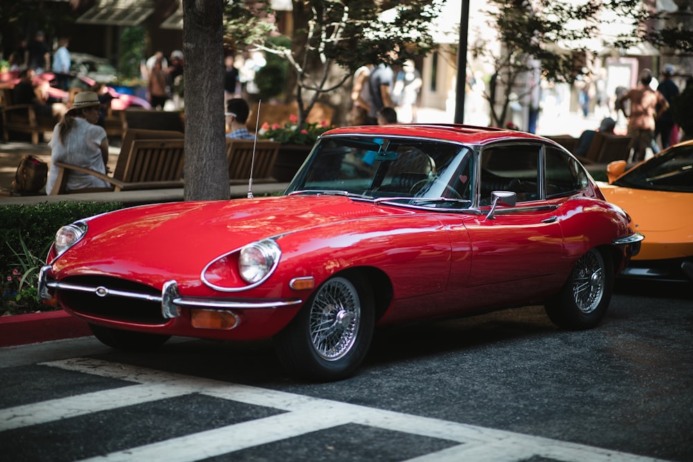 red coupe on road