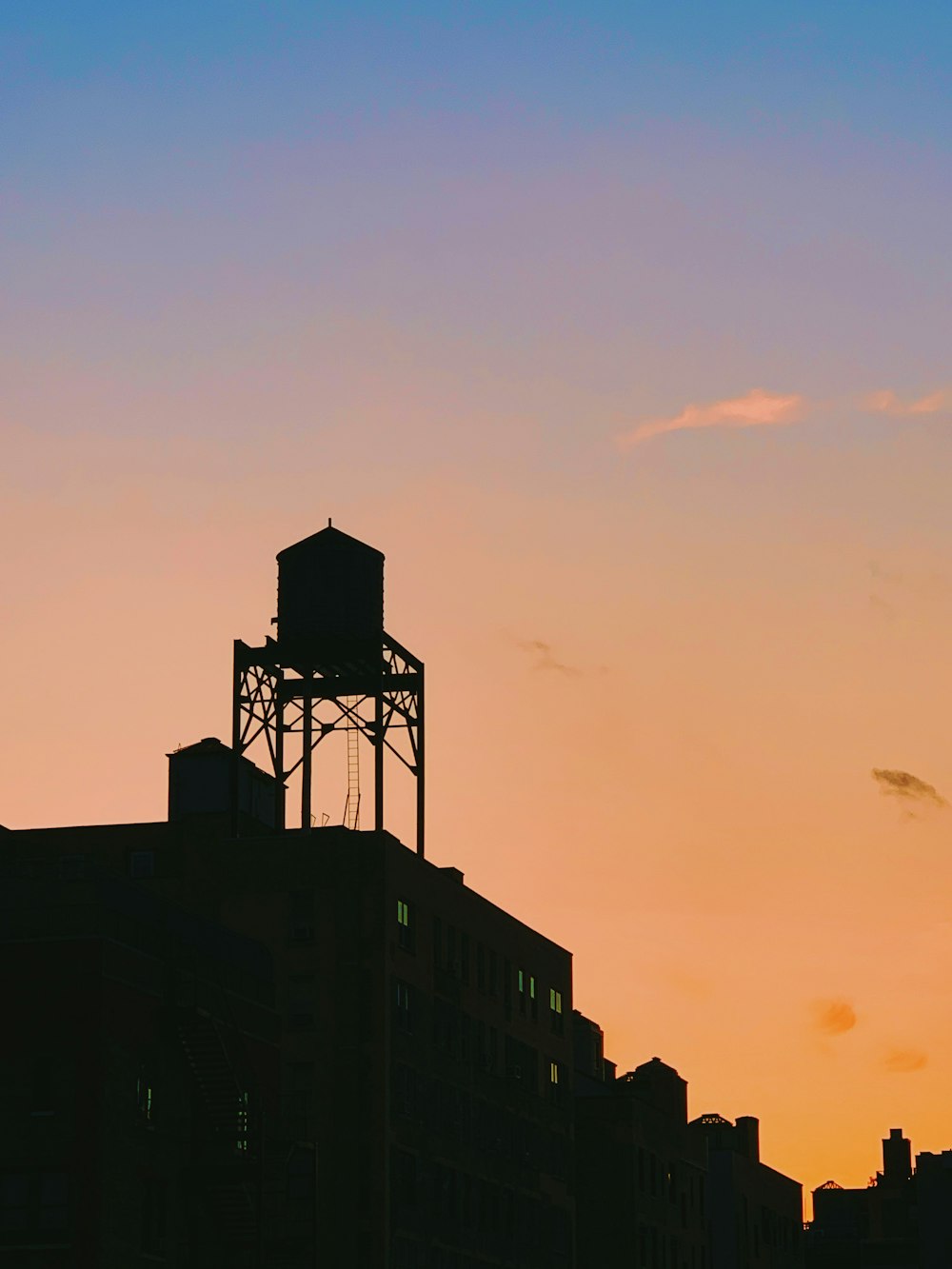 silhouette of water reservoir during golden hour