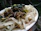 A close-up of a vibrant plate with loaded chips and noodles, ready to eat.