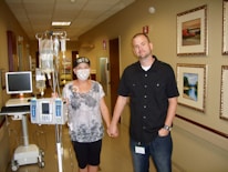 man holding woman's hand