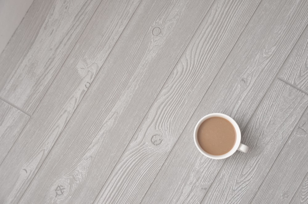 coffee in cup on wooden surface