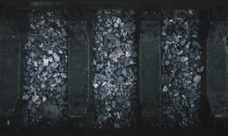a black and white photo of rocks and gravel