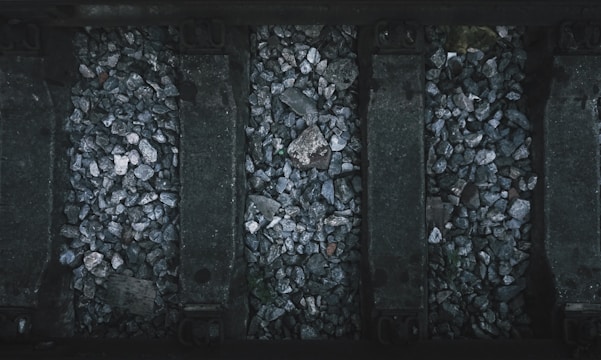 a black and white photo of rocks and gravel
