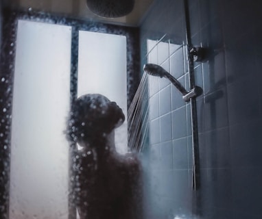 woman under showerhead