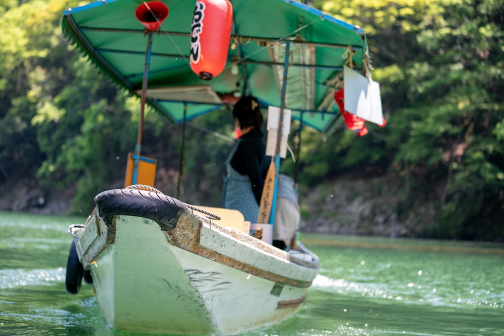 white and green boat