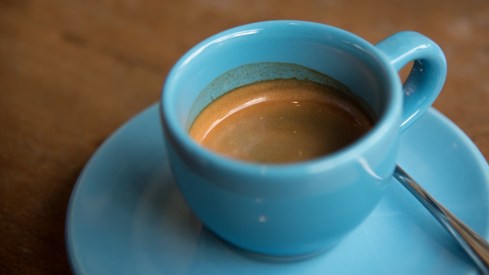 half-filled ceramic cup on saucer