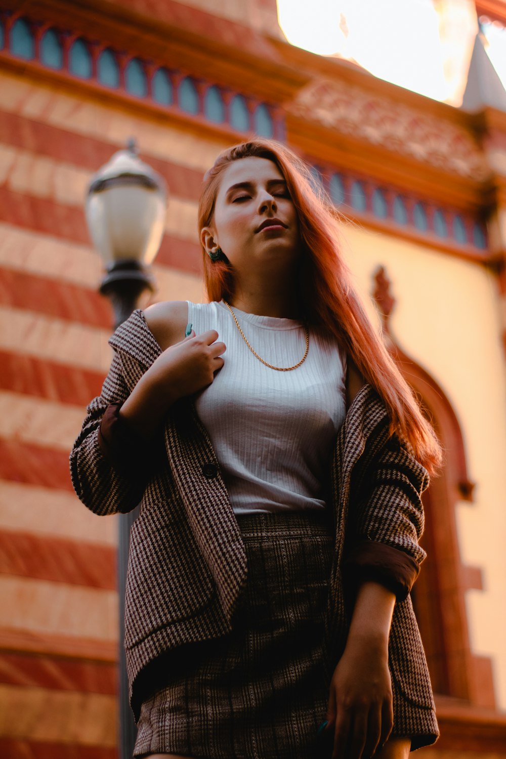 shallow focus photo of woman in gray jacket