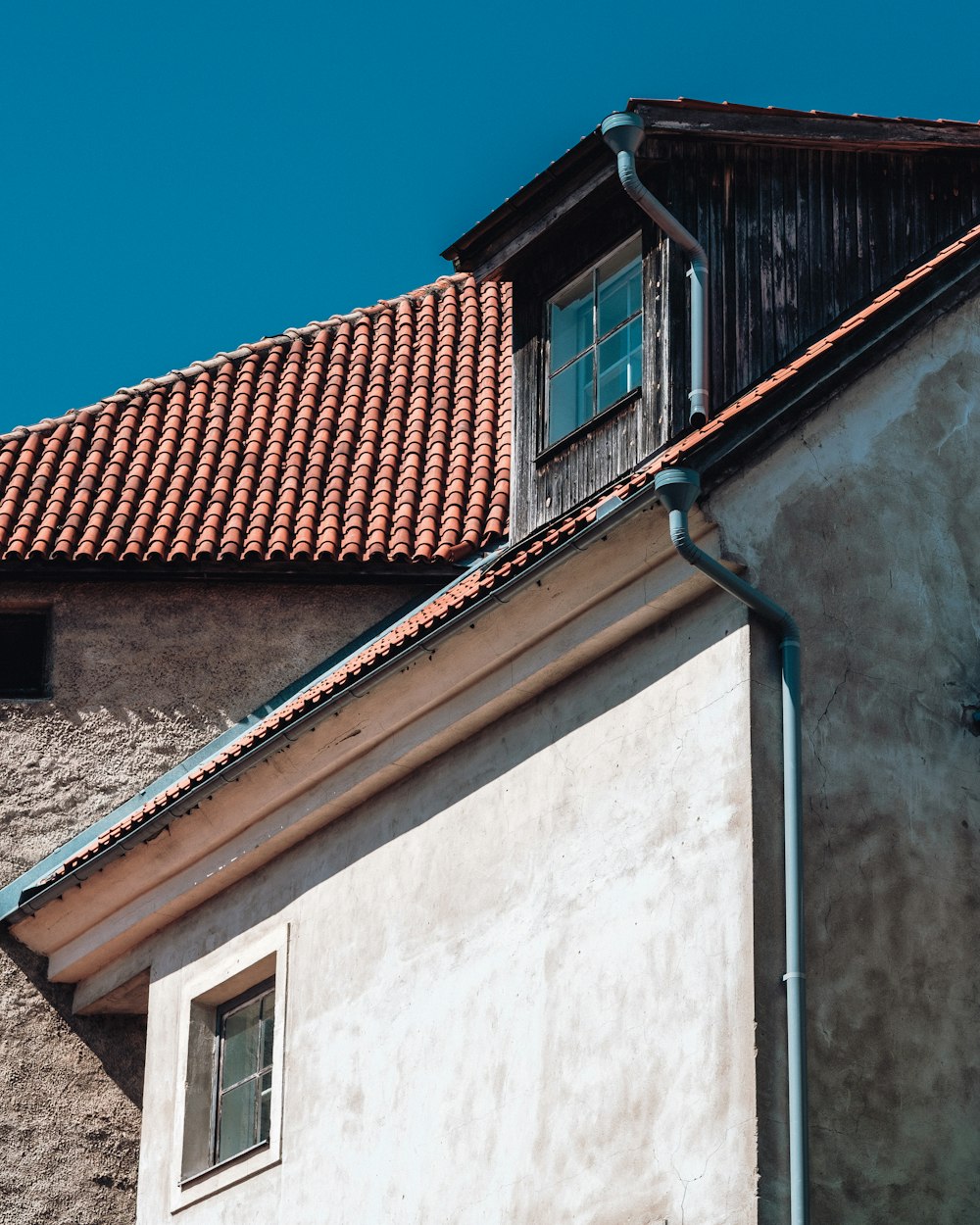 brown concrete house under clear sky