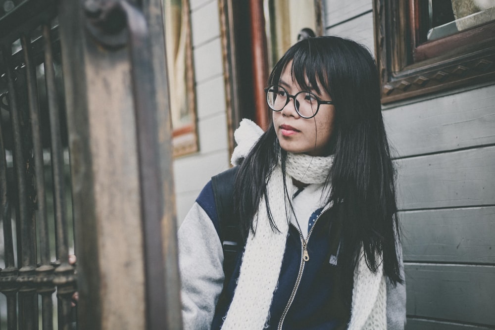 woman in eyeglasses and jacket