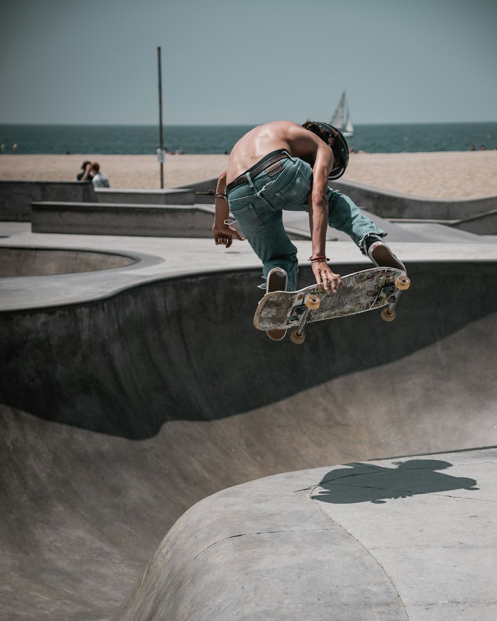 topless man skateboarding outdoors